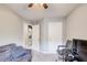 Bedroom featuring a sofa, desk, and view of in-unit laundry at 2758 Snapfinger Mnr, Decatur, GA 30035