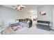 Spacious living area with an open floor plan, gray sofa, neutral walls, and view of the dining area at 2758 Snapfinger Mnr, Decatur, GA 30035