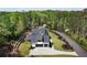 Aerial view of a home on a large lot, mature trees, and a private driveway at 120 Farm Gate Dr, Woodstock, GA 30188