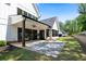 A backyard featuring a covered patio, stone tile and a well-manicured lawn perfect for outdoor living at 120 Farm Gate Dr, Woodstock, GA 30188