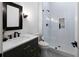 Modern bathroom features a walk-in shower with white subway tile, and a dark wood vanity with a white countertop at 120 Farm Gate Dr, Woodstock, GA 30188
