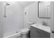 Bathroom featuring a walk-in shower with white tile, modern fixtures, and a grey vanity at 120 Farm Gate Dr, Woodstock, GA 30188