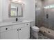 Bathroom with a glass enclosed shower, modern vanity, and elegant mirror at 120 Farm Gate Dr, Woodstock, GA 30188