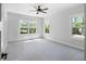 Bright bedroom featuring large windows and plush carpeting at 120 Farm Gate Dr, Woodstock, GA 30188