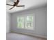 Bedroom with neutral walls, plush carpeting, and natural light at 120 Farm Gate Dr, Woodstock, GA 30188