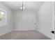 Minimalist bedroom with neutral paint, and modern lighting fixture at 120 Farm Gate Dr, Woodstock, GA 30188