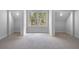 Bonus room featuring built-in alcoves and a large window with backyard view at 120 Farm Gate Dr, Woodstock, GA 30188