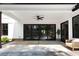 Covered patio features a ceiling fan, sliding glass doors, and a seating area, perfect for relaxation at 120 Farm Gate Dr, Woodstock, GA 30188