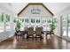 Bright dining room with a large table, hardwood floors, lots of windows, and access to the backyard at 120 Farm Gate Dr, Woodstock, GA 30188
