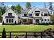 Beautiful two-story home featuring black frame windows and a meticulously manicured front lawn at 120 Farm Gate Dr, Woodstock, GA 30188