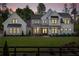 Stunning two-story home with a beautifully landscaped front yard and a charming, covered entry at 120 Farm Gate Dr, Woodstock, GA 30188