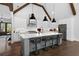 Bright kitchen with a large island, white cabinets, stainless steel appliances, and hardwood floors at 120 Farm Gate Dr, Woodstock, GA 30188
