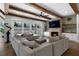 Beautiful living room featuring wooden beams, a brick fireplace, and sliding glass doors to the backyard at 120 Farm Gate Dr, Woodstock, GA 30188