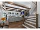 Beautiful living room with hardwood floors, a fireplace, wooden beams, and a staircase at 120 Farm Gate Dr, Woodstock, GA 30188