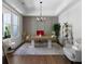 Well-appointed home office with a large desk, ample natural light, and modern decor at 120 Farm Gate Dr, Woodstock, GA 30188