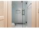 Bathroom boasts a glass-enclosed shower with white tile and sleek, modern fixtures at 2109 Defoors Ferry Nw Rd # D, Atlanta, GA 30318