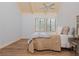 Bedroom with wood floors, vaulted ceiling, and large windows for plenty of natural light at 2109 Defoors Ferry Nw Rd # D, Atlanta, GA 30318