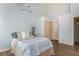 Spacious bedroom featuring wood floors, vaulted ceiling, and a convenient closet and bathroom at 2109 Defoors Ferry Nw Rd # D, Atlanta, GA 30318