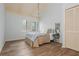 Bright bedroom featuring wood floors, a vaulted ceiling, and ample closet space at 2109 Defoors Ferry Nw Rd # D, Atlanta, GA 30318