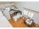 Open-concept kitchen and dining area with hardwood floors and large windows, providing natural light at 2109 Defoors Ferry Nw Rd # D, Atlanta, GA 30318