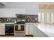 Modern kitchen with stone counter tops and backsplash, with stainless steel oven at 2109 Defoors Ferry Nw Rd # D, Atlanta, GA 30318