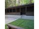 Inviting backyard patio featuring an elegant design and enhanced with stylish string lights at 3572 Adkins Nw Rd, Atlanta, GA 30331