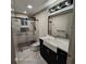 Modern bathroom featuring a sleek vanity, a spacious shower with elegant marble walls at 3572 Adkins Nw Rd, Atlanta, GA 30331