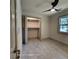 Bright bedroom with a ceiling fan, a closet, and natural light from an adjacent window at 3572 Adkins Nw Rd, Atlanta, GA 30331