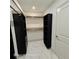 Well-organized walk-in closet with custom shelving, drawers, and ample storage space at 3572 Adkins Nw Rd, Atlanta, GA 30331