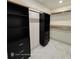 Custom closet featuring black storage cabinets, drawers, and shelving for optimal organization at 3572 Adkins Nw Rd, Atlanta, GA 30331