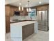 Modern kitchen with stainless steel appliances, herringbone backsplash and beautiful island at 3572 Adkins Nw Rd, Atlanta, GA 30331