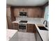 Kitchen featuring stainless steel appliances, sleek cabinetry and stone countertops at 3572 Adkins Nw Rd, Atlanta, GA 30331