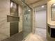 Modern shower with glass doors, dual shower heads, and designer tile at 3572 Adkins Nw Rd, Atlanta, GA 30331