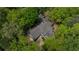 An aerial view shows a large, well-maintained home nestled among mature trees, offering privacy and tranquility at 5251 Powers Ferry Rd, Atlanta, GA 30327