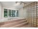 Bathroom featuring a soaking tub with glass block wall and large window at 5251 Powers Ferry Rd, Atlanta, GA 30327