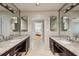 Bathroom featuring dual sinks and dark wood cabinets at 5251 Powers Ferry Rd, Atlanta, GA 30327