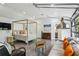 Spacious bedroom with concrete floors, garage doors, and a canopy bed at 5251 Powers Ferry Rd, Atlanta, GA 30327