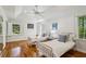 Bedroom with two twin beds, windows with shutters, and wood floors at 5251 Powers Ferry Rd, Atlanta, GA 30327