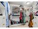 Walk-in closet with custom shelves and plenty of storage at 5251 Powers Ferry Rd, Atlanta, GA 30327