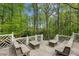 Spacious wooden deck with built-in benches, perfect for outdoor entertaining at 5251 Powers Ferry Rd, Atlanta, GA 30327