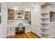 Cozy home office with custom built-in shelving, cabinets, drawers, and a desk, perfect for remote work at 5251 Powers Ferry Rd, Atlanta, GA 30327