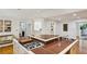 Granite island with cooktop, sink, and bar seating enhances this kitchen's functionality and style at 5251 Powers Ferry Rd, Atlanta, GA 30327