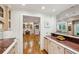 Kitchen view featuring granite countertops, and access to other rooms showcasing the open floorplan at 5251 Powers Ferry Rd, Atlanta, GA 30327