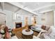 Bright living room with fireplace, views to office and kitchen create a cozy and inviting space at 5251 Powers Ferry Rd, Atlanta, GA 30327