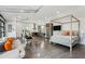 Open-concept living space with a kitchen, dining area, and bedroom; concrete floors at 5251 Powers Ferry Rd, Atlanta, GA 30327