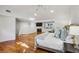 This main bedroom has hardwood floors, fireplace, and ceiling fan at 5251 Powers Ferry Rd, Atlanta, GA 30327