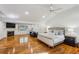 Spacious main bedroom boasts hardwood floors, fireplace, and a sitting area providing relaxation and style at 5251 Powers Ferry Rd, Atlanta, GA 30327