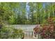 A private tennis court nestled among lush greenery, offering a secluded recreational space at 5251 Powers Ferry Rd, Atlanta, GA 30327
