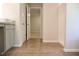 Bathroom showcasing tile flooring and a doorway leading to an adjacent room at 678 Egrets Landing #63, Covington, GA 30014