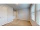 Bedroom with carpet, white trim, window at 678 Egrets Landing #63, Covington, GA 30014